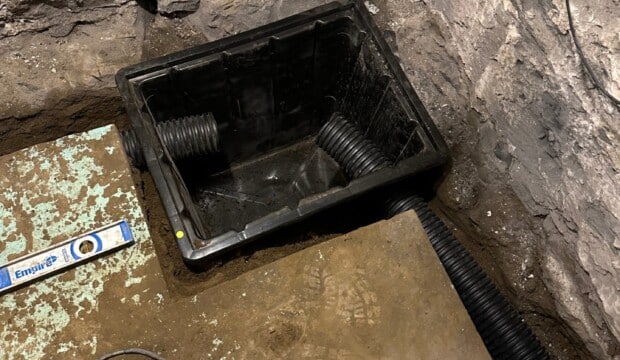 Interior drain connecting to catch bassin